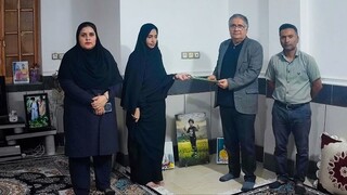 تجلیل از خانواده شهیده ورزشکار سنار سالاری